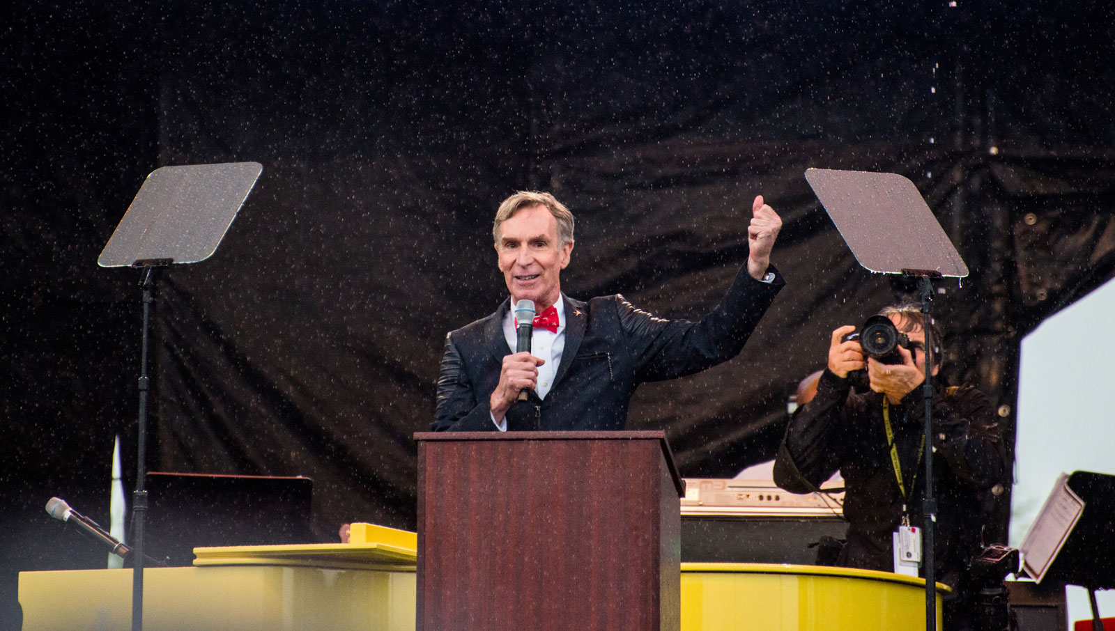 Bill speaking in rain